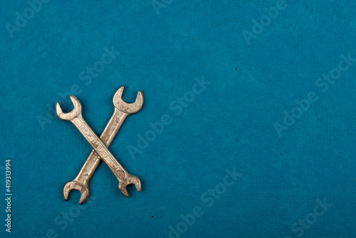 Set of tools on blue background as labour day background © StillSujith