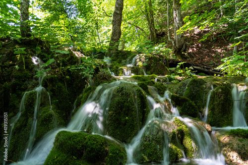 Waterfall with turquoise water in the Plitvice Lakes National Park  Croatia.