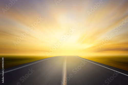 asphalt road and sunset motion blur