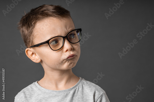 child looking into wide angle lens on white background