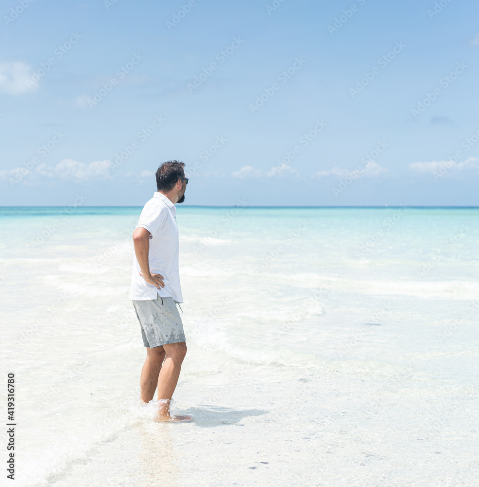 One man is enjoying beautiful tropical beach One man is enjoying beautiful tropical beach