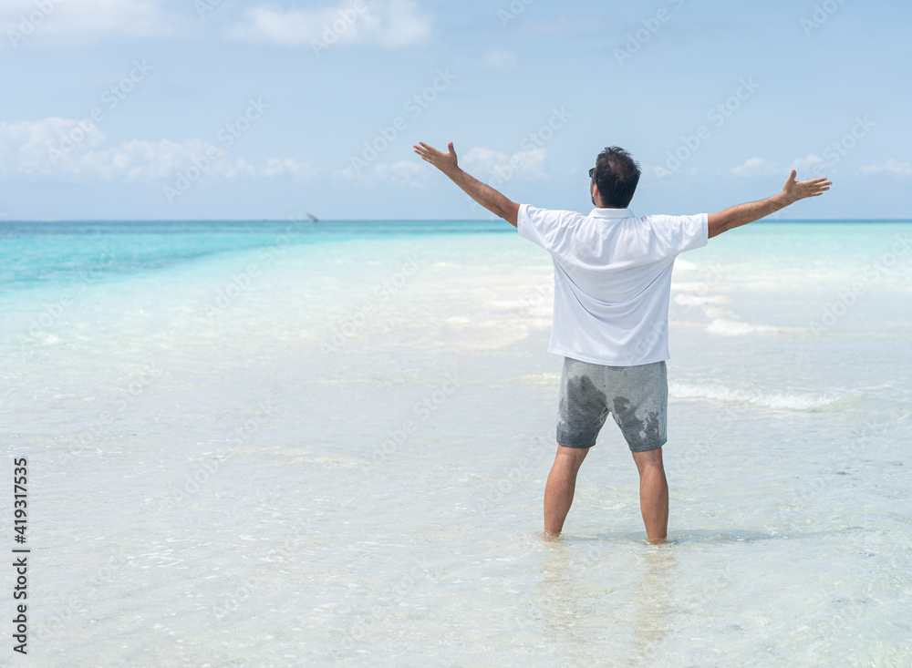 One man is enjoying beautiful tropical beach One man is enjoying beautiful tropical beach