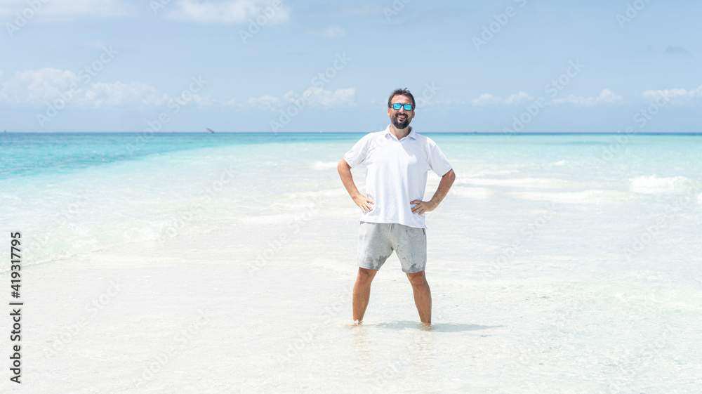 One man is enjoying beautiful tropical beach One man is enjoying beautiful tropical beach