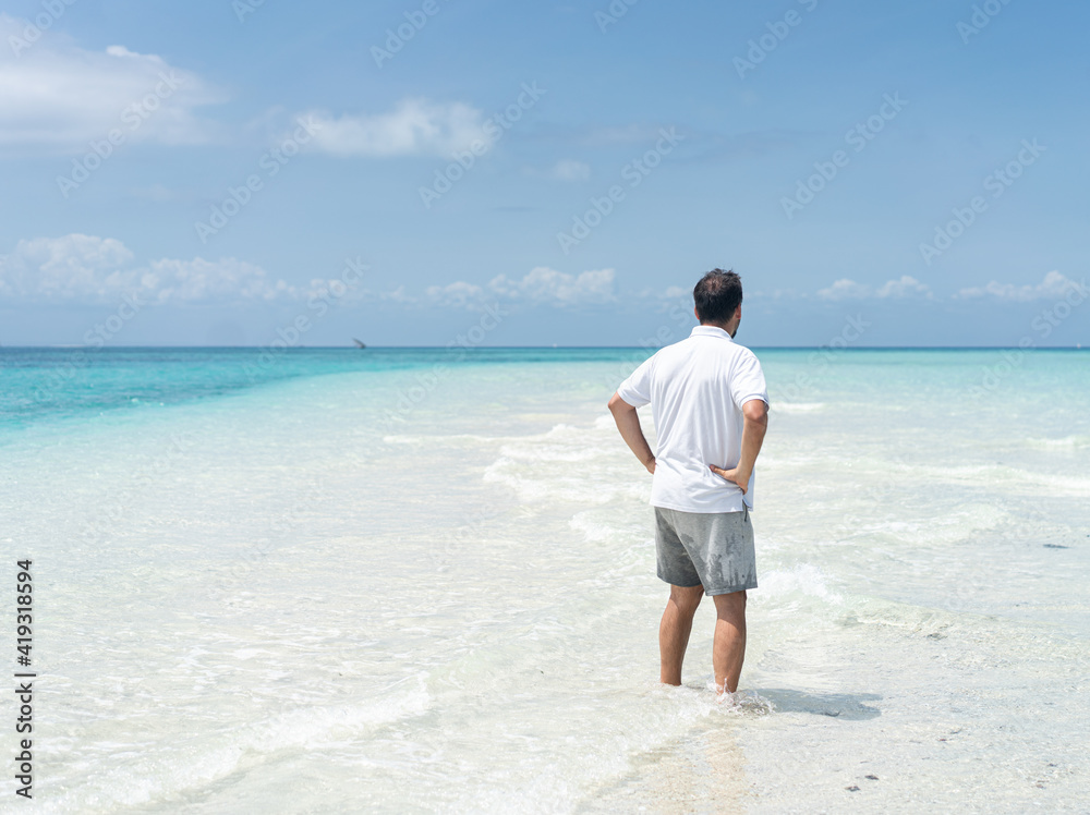 One man is enjoying beautiful tropical beach One man is enjoying beautiful tropical beach