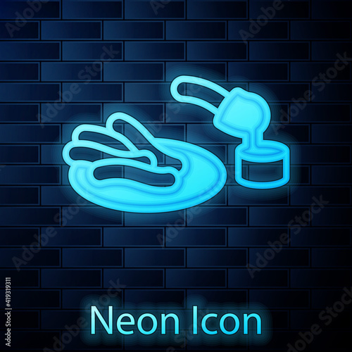 Glowing neon Churros and chocolate icon isolated on brick wall background. Traditional national Spain dessert, European street food. Vector.