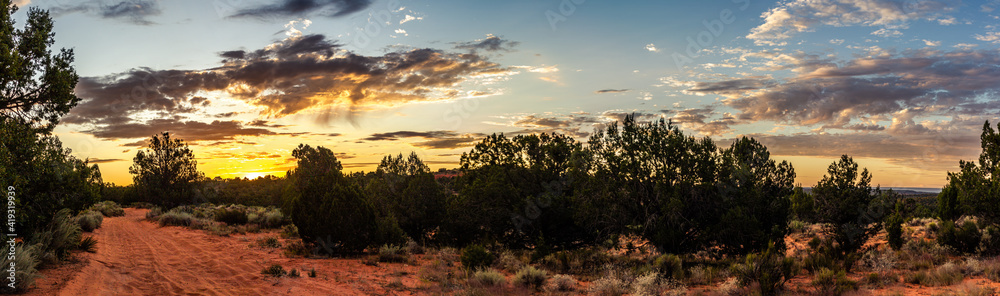 Panorama shot of sunrise with morning clouds over Colorado sandy desert bushes in america Panorama shot of sunrise with morning clouds over Colorado sandy desert bushes in america
