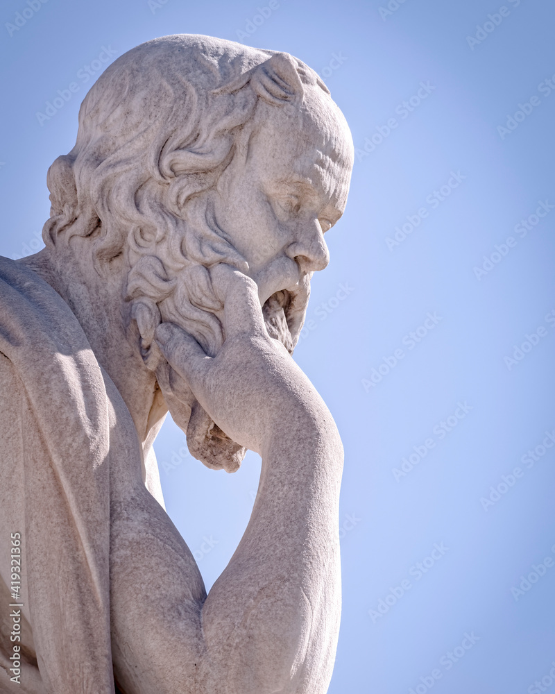 Socrates the ancient Greek philosopher and thinker white marble bust sculpture under blue sky, Athens Greece