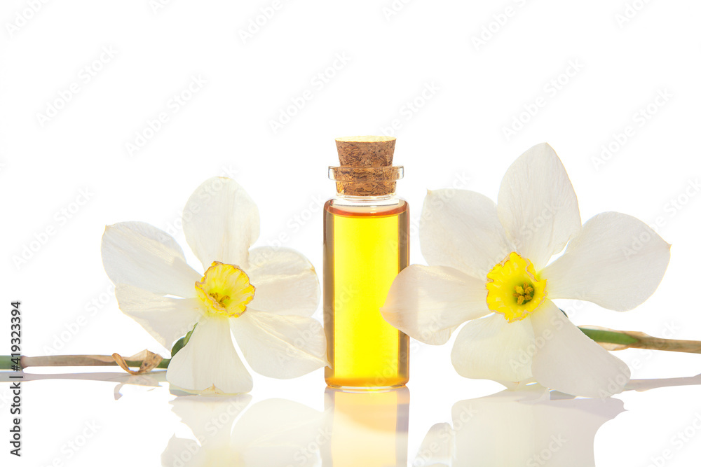 Essence of flowers on white in beautiful glass jar Essence of flowers on white in beautiful glass jar