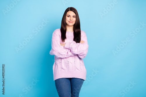 Photo of young attractive woman happy positive smile confident crossed hands isolated over blue color background