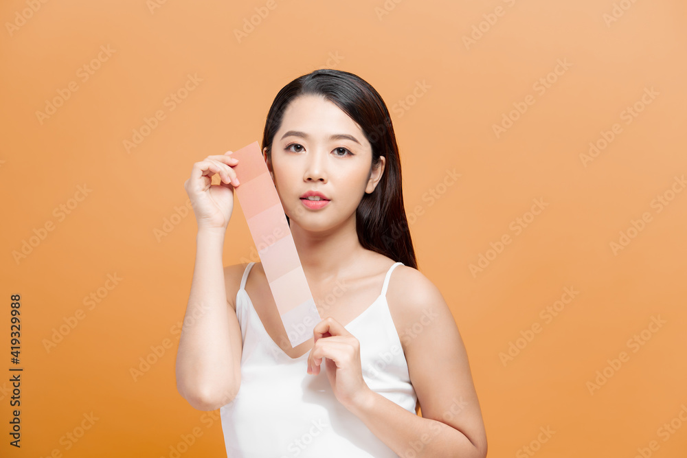 Beauty Skin care woman showing skin color paper, with clean face skin, concept for skin care, asian