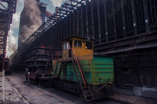 coke and chemicals plant.unloading of hot coke and from the furnace to a coke oven truck photo