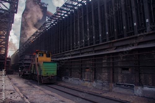 coke and chemicals plant.unloading of hot coke and from the furnace to a coke oven truck photo