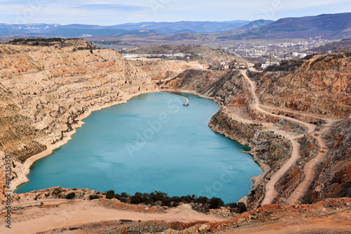 the opened blue heart of the earth - abandoned quarry with a heart-shaped lake at the bottom