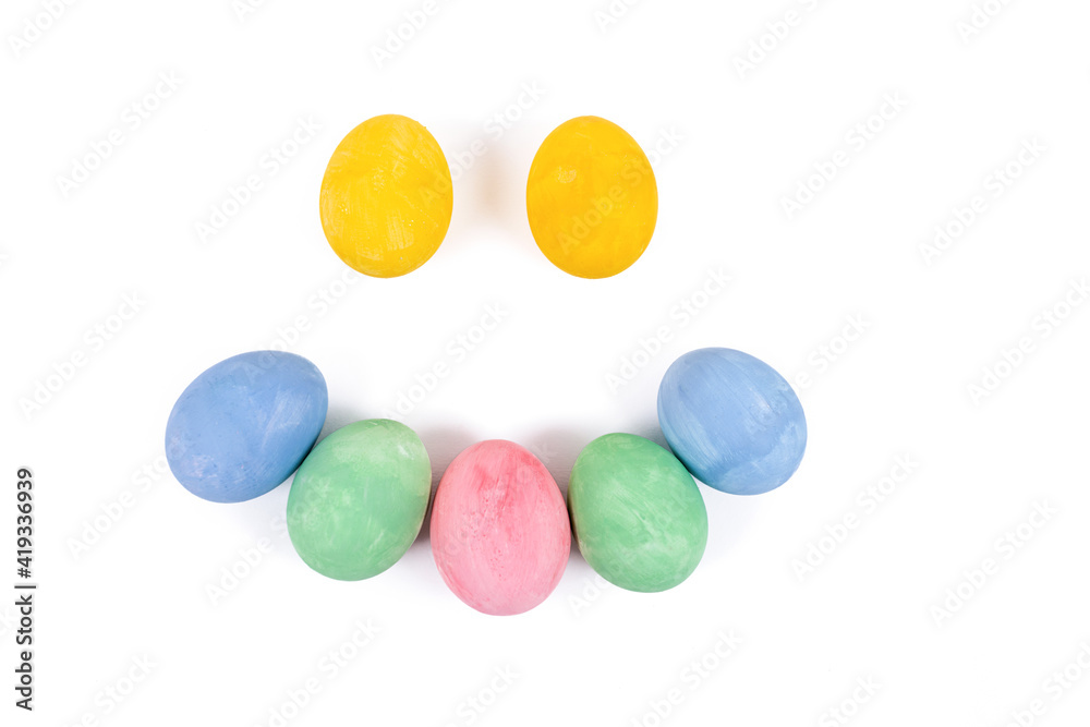 Easter eggs smile face. Multi-colored eggs making a smile face isolated on a white background
