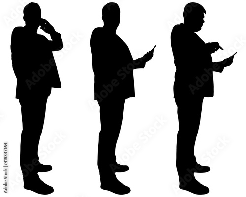 Businessman with a phone in hands. Side view, profile. Man in a business suit is talking on the phone, looking at the smartphone screen, typing a message with his finger. Three male black silhouettes	 photo