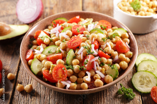 chickpea salad with tomato, cucumber, avocado and onion