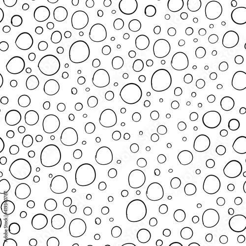 Seamless vector pattern with black circles on white background. Doodle vector illustration.
