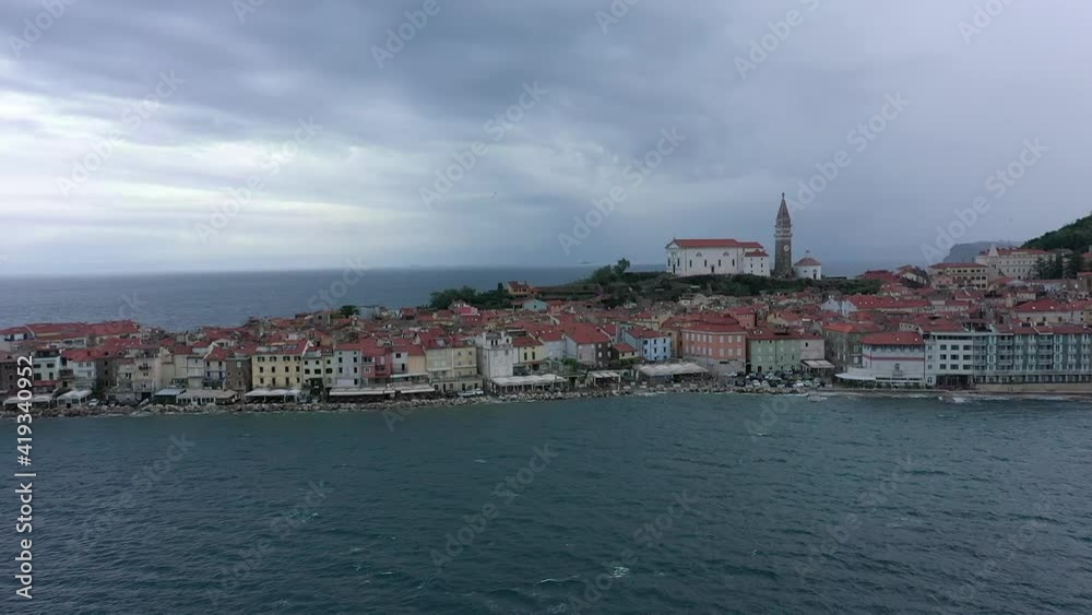 Dark rain clouds form above the ancient city of Piran Dark rain clouds form above the ancient city of Piran
