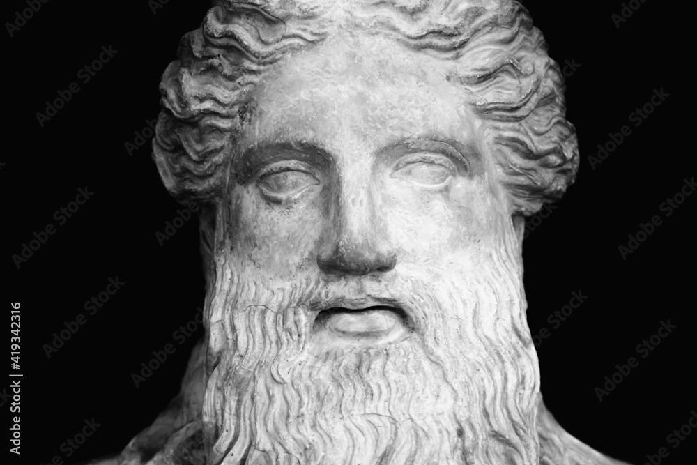 God Zeus (Jupiter). The king of Olympian gods and the ruler of sky and thunder. Fragment of an ancient statue. Horizontal image.