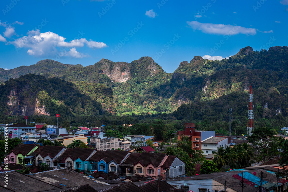 Fototapeta premium Blurred abstract background from high angle from plane window, overlooking the scenery below (river, mountain, tree).