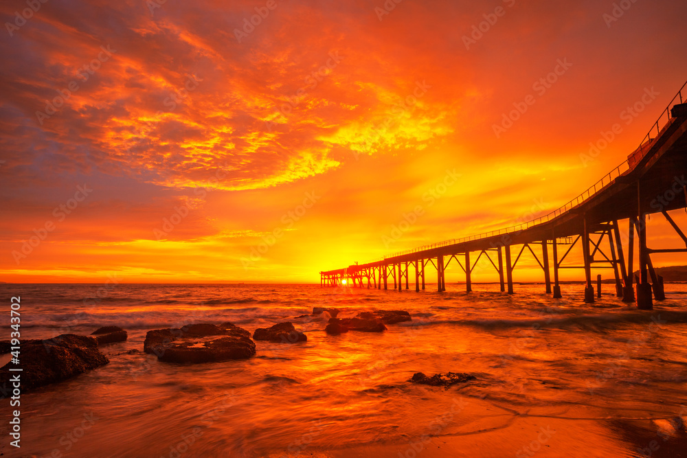 Beautiful, vivid, autumn, sunrise over  Historic Wallarah Jetty .Catherine Hill Bay. Central Coast of N.S.W. Australia.