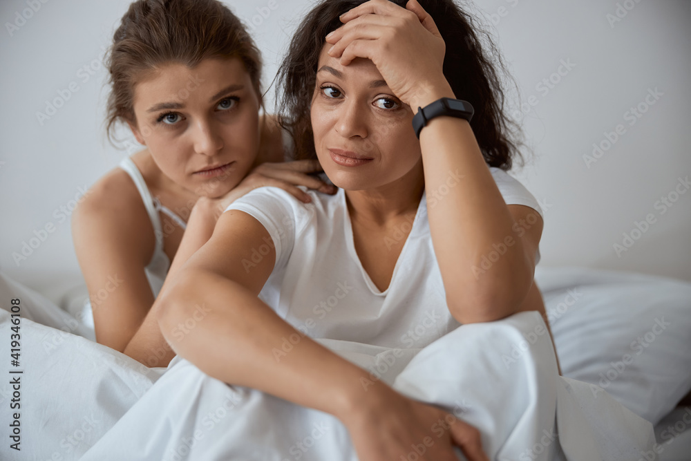 Two young ladies looking straight at camera Two young ladies looking straight at camera