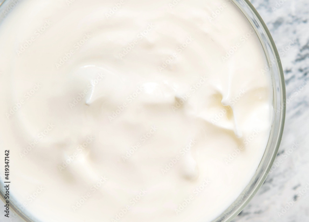 Homemade yogurt or sour cream in a bowl Homemade yogurt or sour cream in a bowl