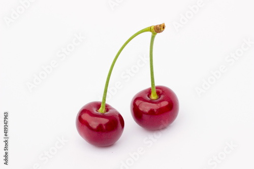 cherries isolated,
two cherries on a white background,
ripe cherry