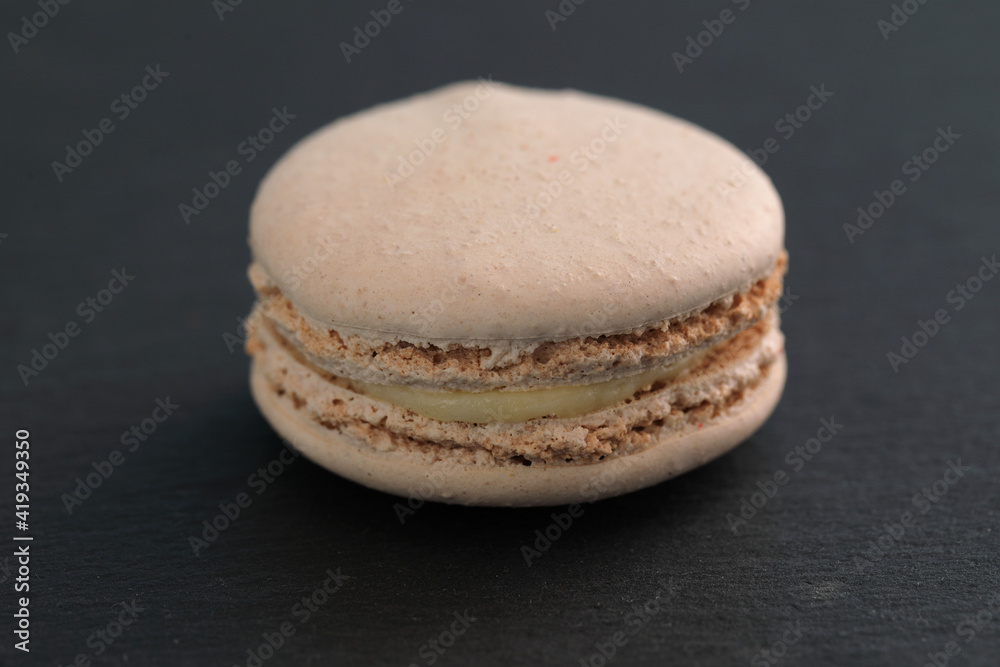 Colorful macarons isolated in black background Colorful macarons isolated in black background