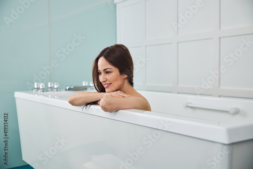 Pretty lady liking her spa bath massage