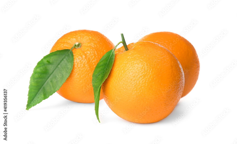 Fresh ripe oranges with green leaves on white background Fresh ripe oranges with green leaves on white background