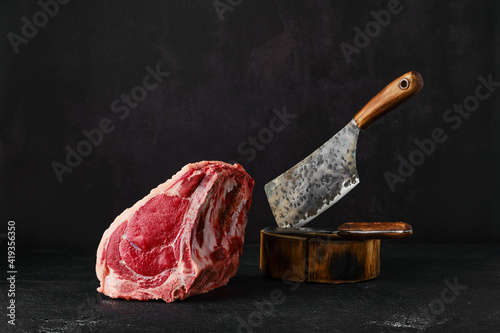 Raw rib-eye steak bone in