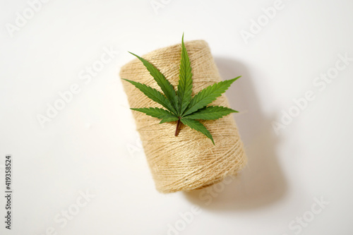 Hemp rope. Industrial cannabis skein of thread. Marijuana leaf. Zero waste textile top view