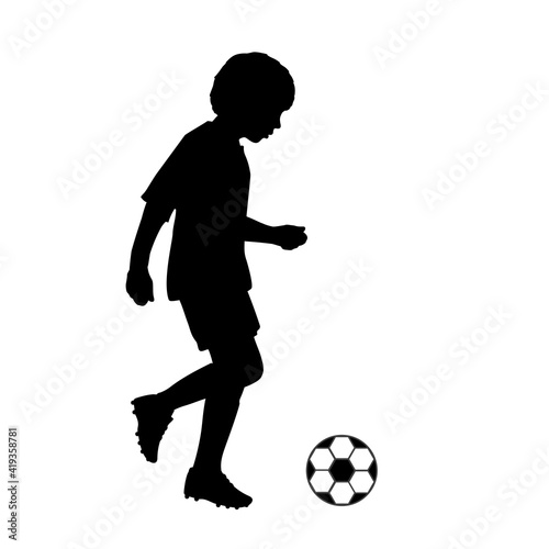 Silhouette child joggling with soccer ball