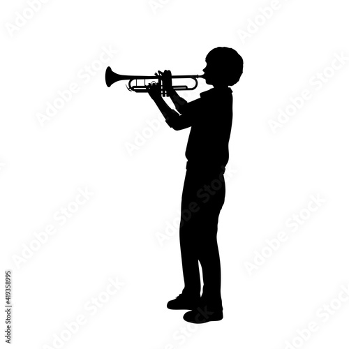 Silhouette boy playing the trumpet