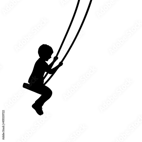 Silhouette young boy on swings sideways