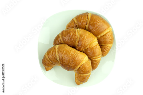 Fresh and tasty croissant in white plate white background