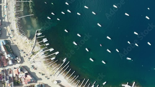 Copacabana city in Bolivia and boats at Titicaca lake aerial view