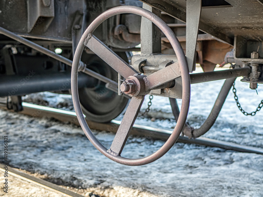 The steering wheel of brakes of of the railway cars.