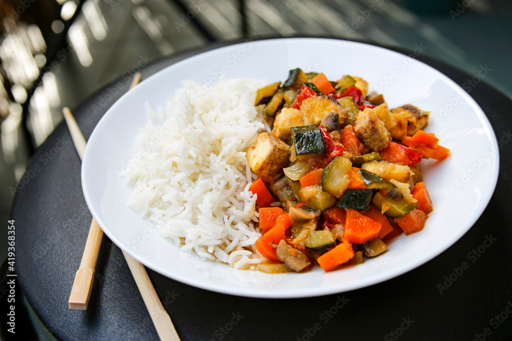 vegetable asian meal tofu and vegetables stir fried with white rice vegetable asian meal tofu and vegetables stir fried with white rice