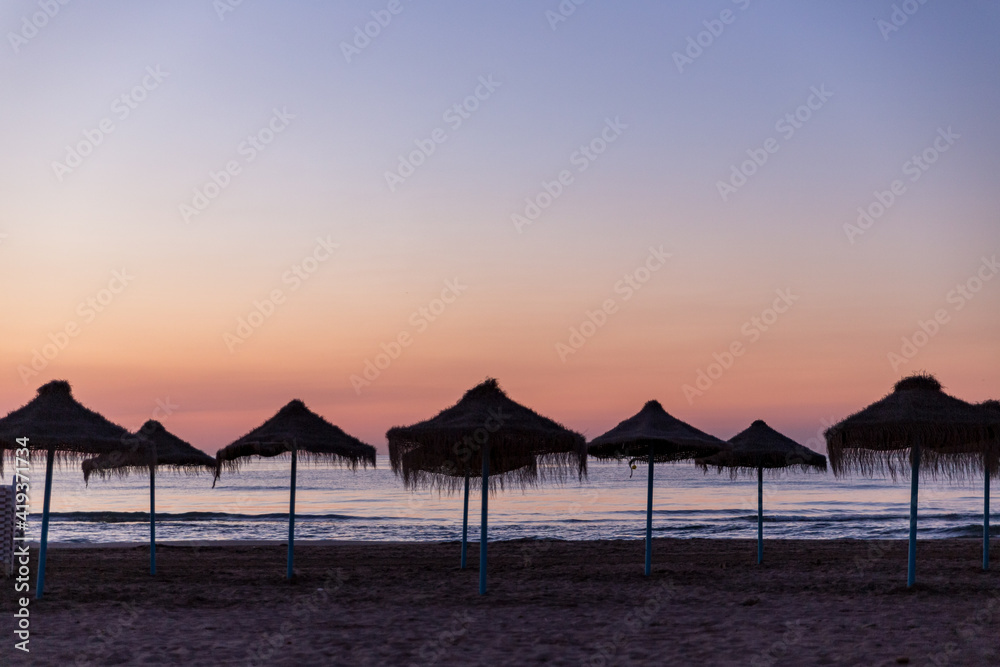 sunrise with beautiful colors at malvarosa beach of the City of valencia, costa blanca, spain