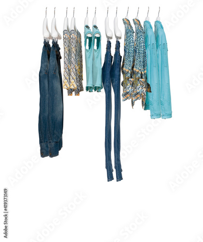 Elegant and trendy clothes for women hanging.