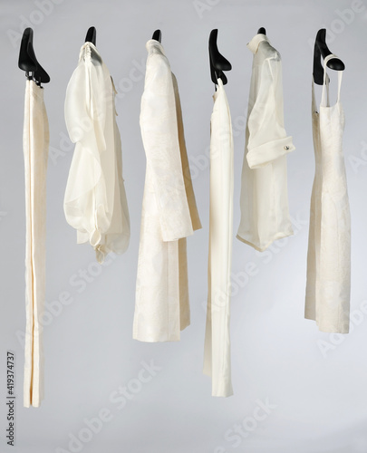 Elegant and trendy women's clothes hanging
