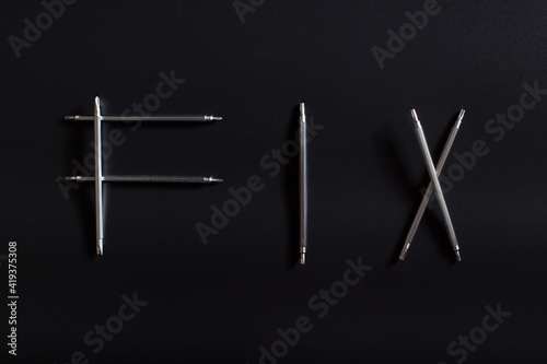 Word fix made of screwdrivers. Tools for reparing small electronics. © Serjik Ahkhundov