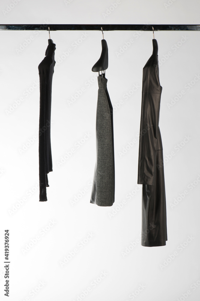 Elegant and trendy women's clothes hanging Elegant and trendy women's clothes hanging