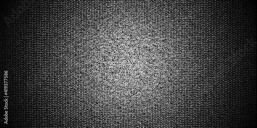 Halftone gradient made of white letters and digits evenly distributed on black background, abstract illustration