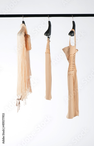 Elegant and trendy women's clothes hanging