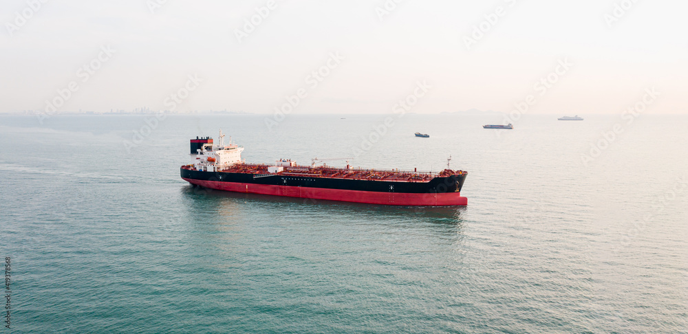 Aerial angle side view of oil tanker container ship at sea. Crude oil tanker lpg ngv at industrial estate Thailand - Oil tanker ship to Port of Singapore - import export 