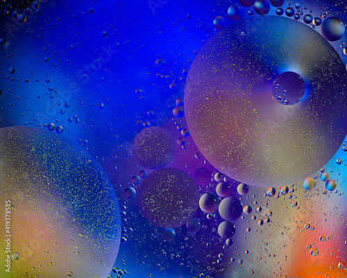 Photo of oil on a water surface with bubbles. Abstract colorful background. Macro close-up, not illustration