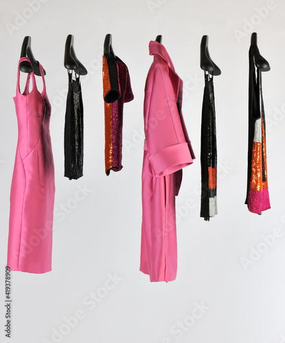 Elegant and trendy women's clothes hanging